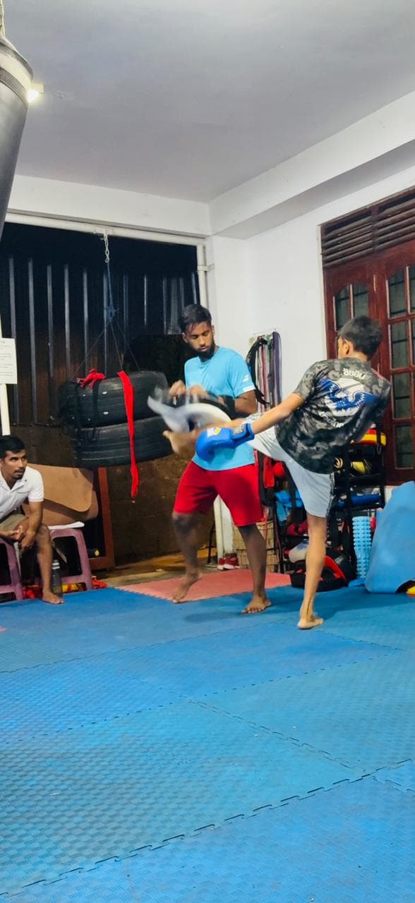 Pad work at the gym